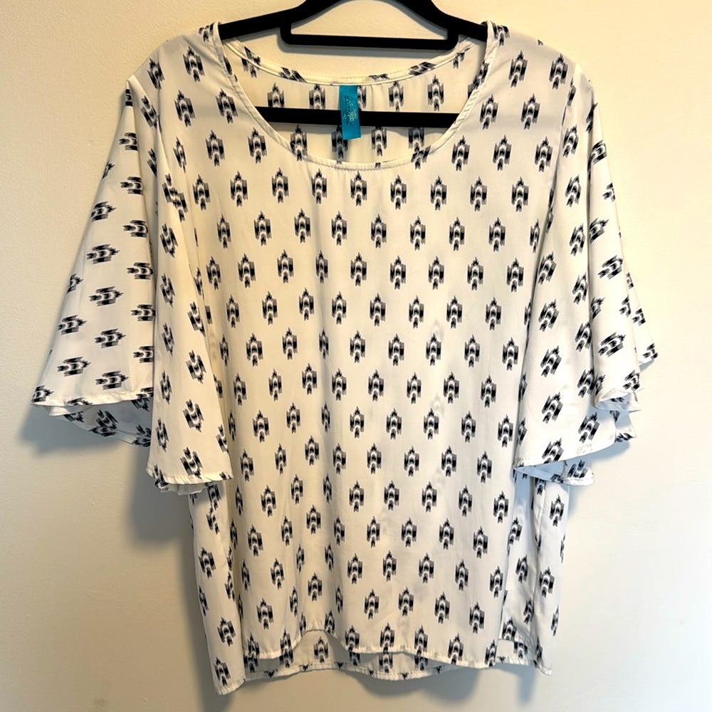 White, silky blouse with black print